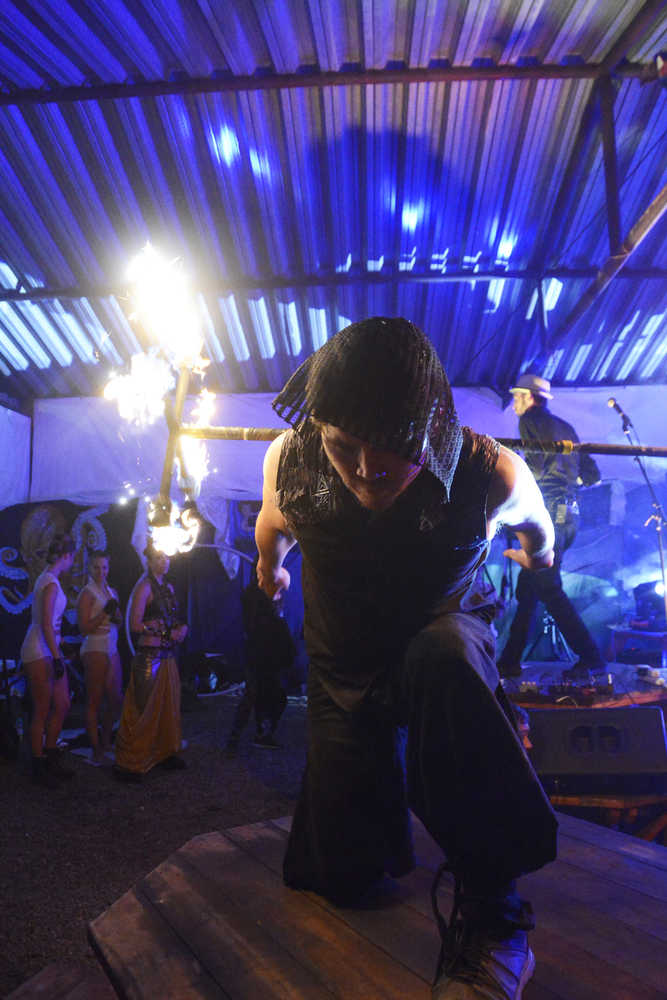 Photo by Megan Pacer/Peninsula Clarion Shane Borth, a violinist and composer for Quixotic, plays during the group's performance Sunday, Aug. 7, 2016 at Salmonfest in Ninilchik, Alaska. Quixotic is a cirque nouveau that blends live music with dance, lights and other performance art.