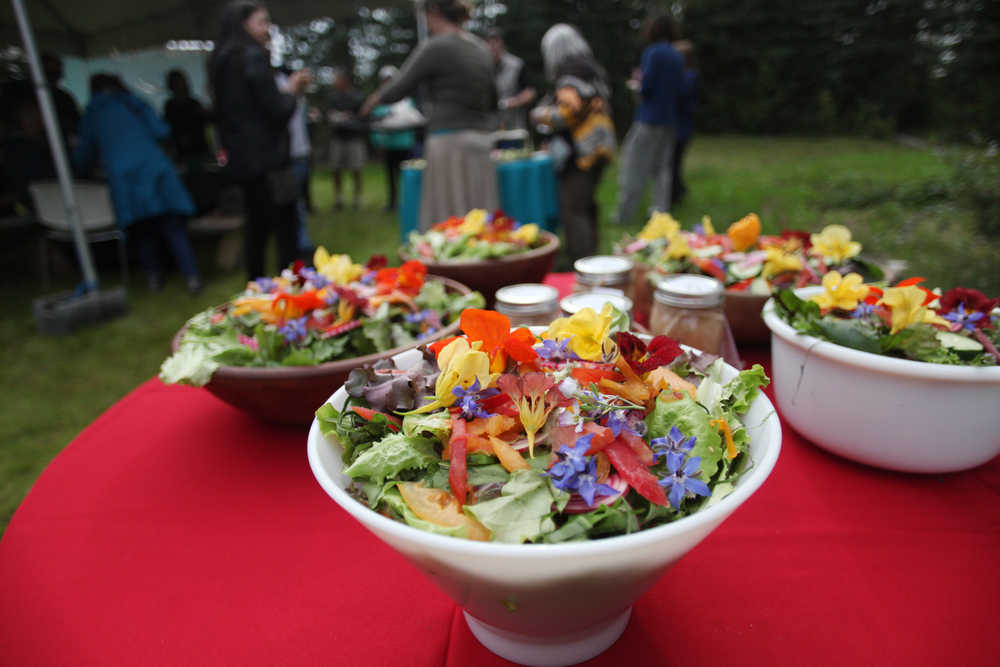 Photo by Kelly Sullivan/ Peninsula Clarion Menu items at the Farm to Table Supper event were made 100 percent from local ingredients by the Willow King, owner of the Where It's At! food bus, and her team of cooks for the Kenai Local Food Connection's third annual Harvest Moon Festival on Sunday, Aug. 14, 2016, in Soldotna, Alaska.