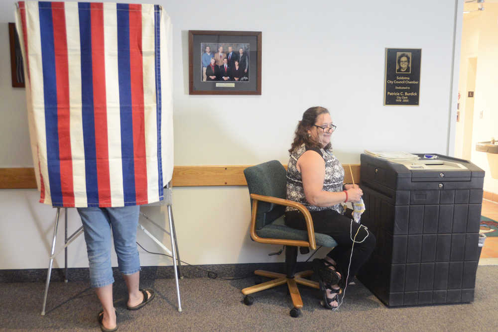 Photo by Megan Pacer/Peninsula Clarion Election volunteer Cathy Carrow prepares to help voters turn in their ballots during the state primary election Tuesday, Aug. 16, 2016 at Soldotna City Hall in Soldota, Alaska.