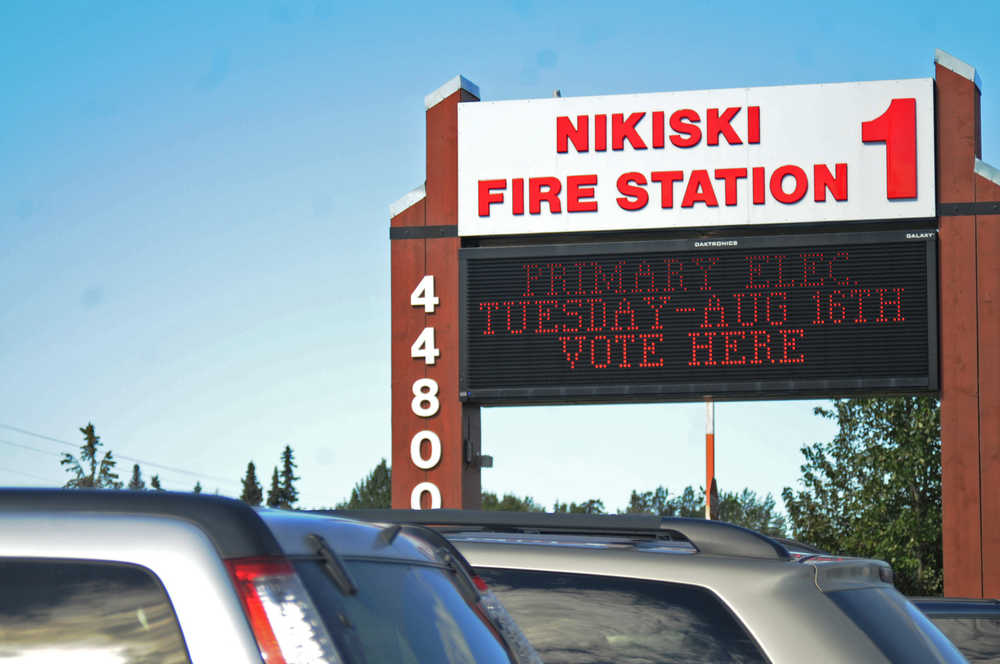 Photo by Elizabeth Earl/Peninsula Clarion A sign advises voters where to stop in to cast their ballot during the primary election Tuesday, Aug. 16, 2016 at Nikiski Fire Station 1 in Nikiski, Alaska.