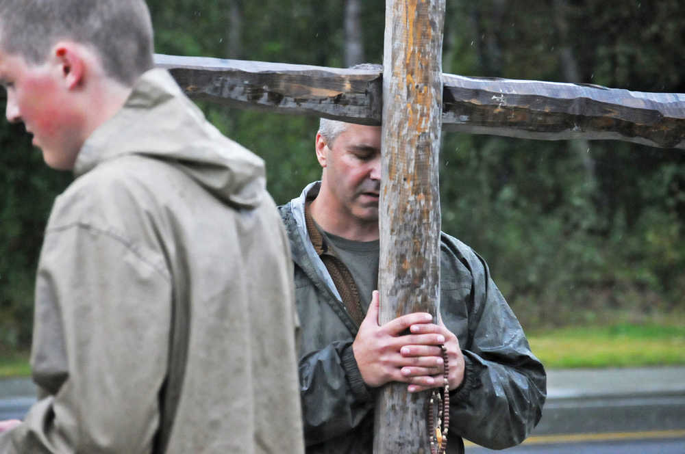 Photo by Elizabeth Earl/Peninsula Clarion Members of the Catholic Church gathered outside the Kenai Peninsula Borough Administration Building on Wednesday, Aug. 17, 2016 in Soldotna, Alaska. The church members gathered to pray in response to a Satanic invocation given before the Aug. 9 boough assembly meeting.