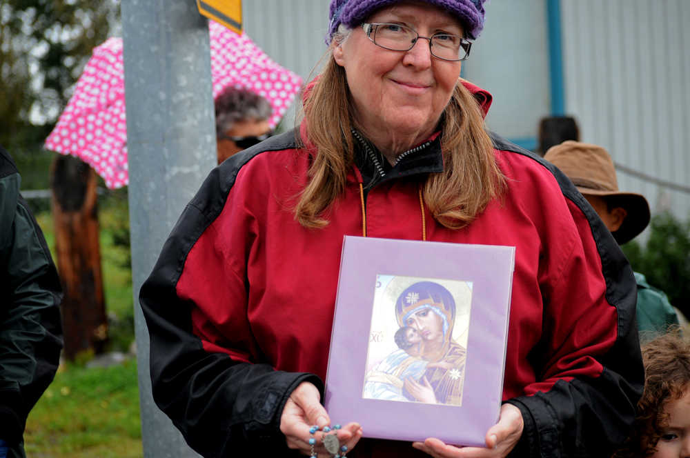 Photo by Elizabeth Earl/Peninsula Clarion Carolyn Boselo gathered with a number of other Catholic Church members near the Planned Parenthood clinic to pray Wednesday, Aug. 17, 2016 in Soldotna, Alaska. It wasn't a protest, Boselo said. "We're just coming here to pray," she said.