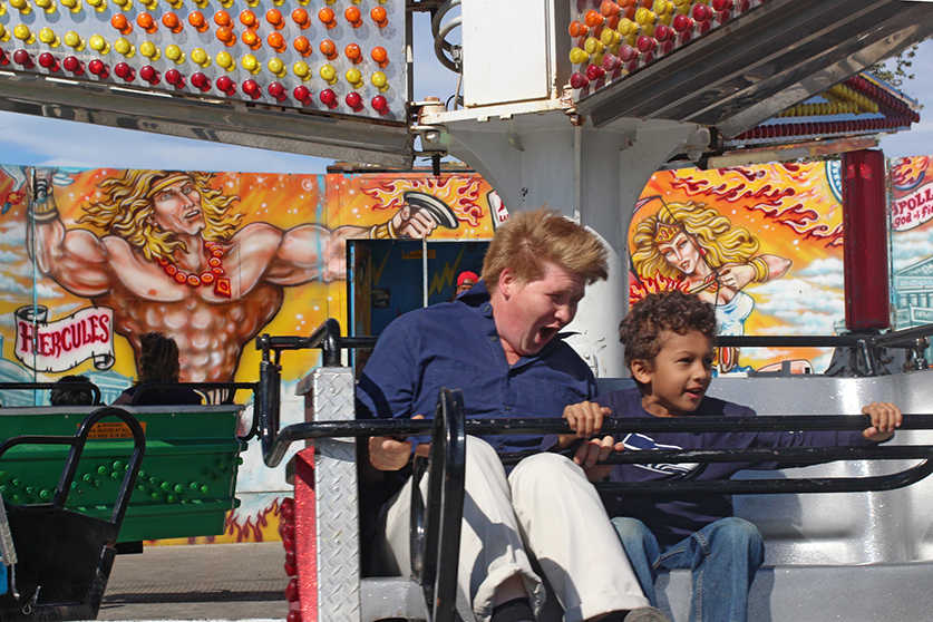 Photo by Ben Boettger/Peninsula Clarion Visitors ride the Tilt-a-whirl at the Kenai Peninsula Fair on Saturday, Aug. 20, 2016 in Ninilchik, Alaska. Today is the fair's last day.