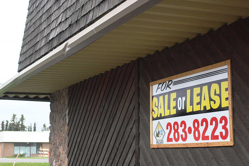 Ben Boettger/Peninsula Clarion The fascade of the former Alaskalanes bowling alley in Kenai displays a sign from its present owners, the city of Kenai, on Saturday, Aug. 20, 2016 in Kenai Alaska. Kenai has recieved four bids for the building to date, two of which are still under consideration.