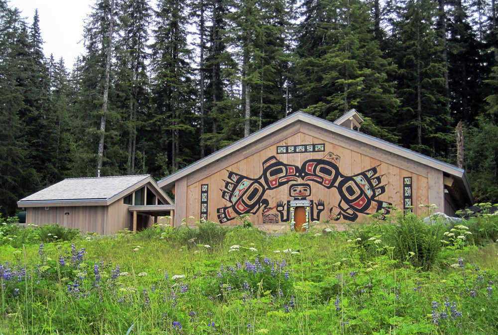 This undated photo provided by the National Park Service on Aug. 19, 2016 shows the Huna Tribal House that will be dedicated on the shores of Glacier Bay National Park and Preserve, Alaska, during ceremonies beginning on Thursday, Aug. 25, 2016. According to the National Park Service, four Huna Tlingit clans traditionally occupied land in and around the present-day park. The building will serve as also an acknowledgment of that heritage. (Steve Schaller/National Park Service via AP)