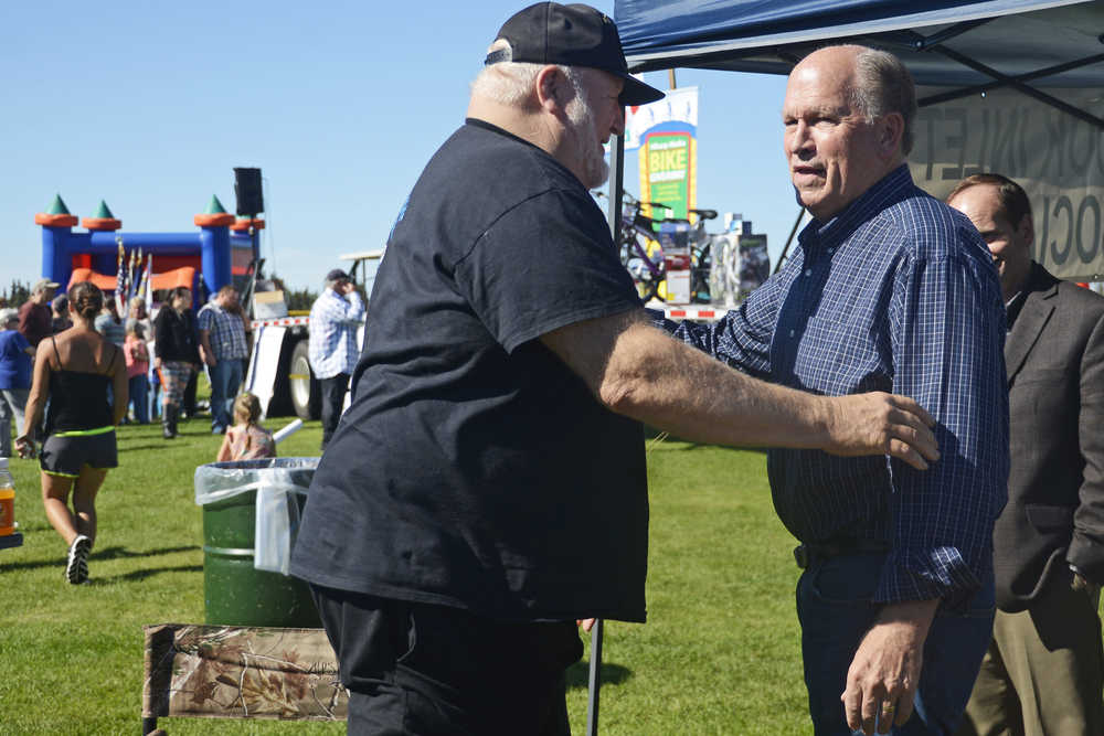 Photo by Megan Pacer/Peninsula Clarion Gov. Bill Walker speaks to a crowd of area residents during Industry Appreciation Day on Saturday, Aug. 28, 2016 in Kenai, Alaska. Walker is making stops across the state to speak to members of local government about the state's fiscal situation.