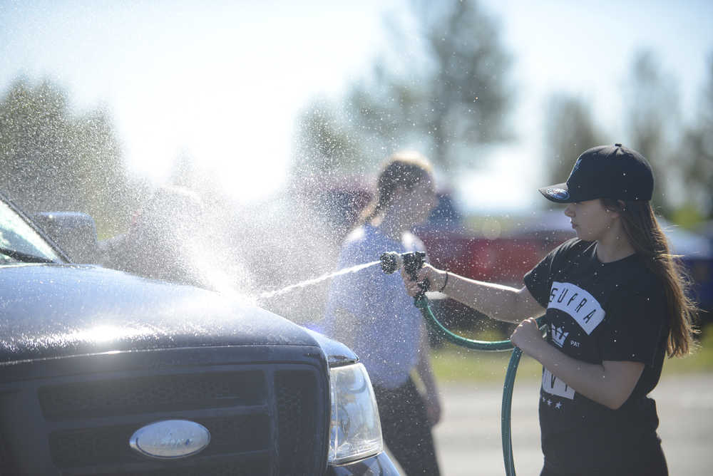 Photo by Kelly Sullivan/ Peninsula Clarion Diamond Dance Project dancers held a fundraiser carwash Sunday, Aug. 28, 2016 in Kenai, Alaska, to help get everyone to the NUVO Dance Convention in September. The group will also host another open house fundraiser from 1-5 p.m., Sept. 18 at the studio on Kalifornsky Beach Road.