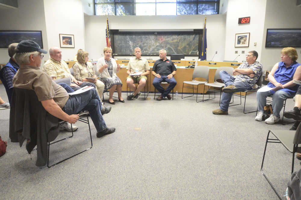 Photo by Megan Pacer/Peninsula Clarion  Members of the Soldotna Charter Commission speak with residents during an open house to discuss the proposed home-rule charter and what it would and would not change about the city Tuesday, Aug. 30, 2016 at Soldotna City Hall in Soldotna, Alaska. Soldotna residents will vote on the measure during the Oct. 4 regular municipal election.