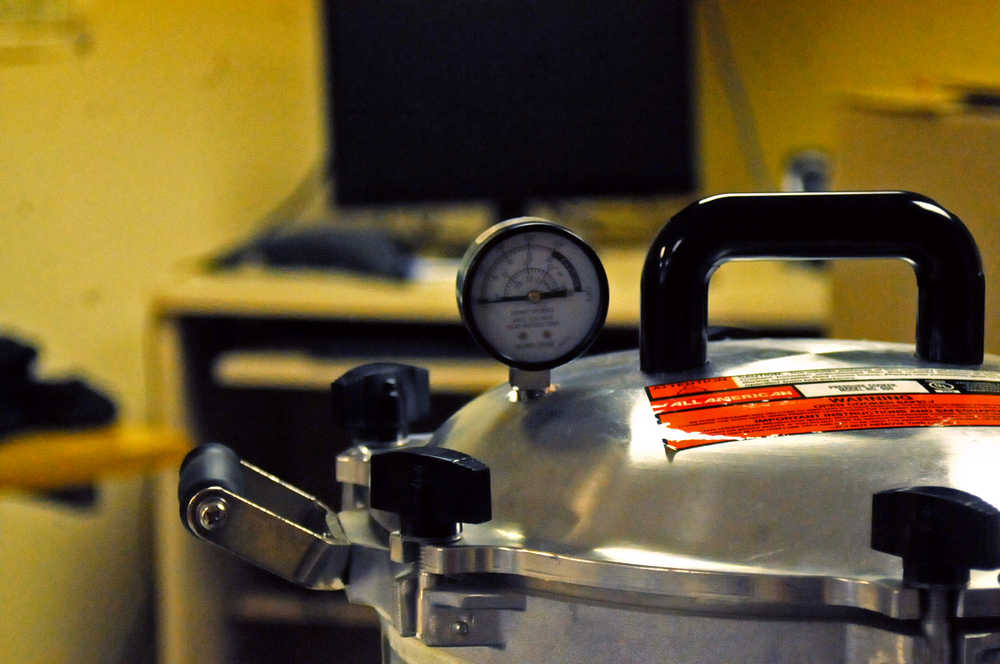 Photo by Elizabeth Earl/Peninsula Clarion A pressure canner sits on the table at the Kenai Cooperative Extension Service office on Wednesday, Aug. 31, 2016 in Soldotna, Alaska. The Cooperative Extension Service offers instruction on how to can fish at its office and in community classes.