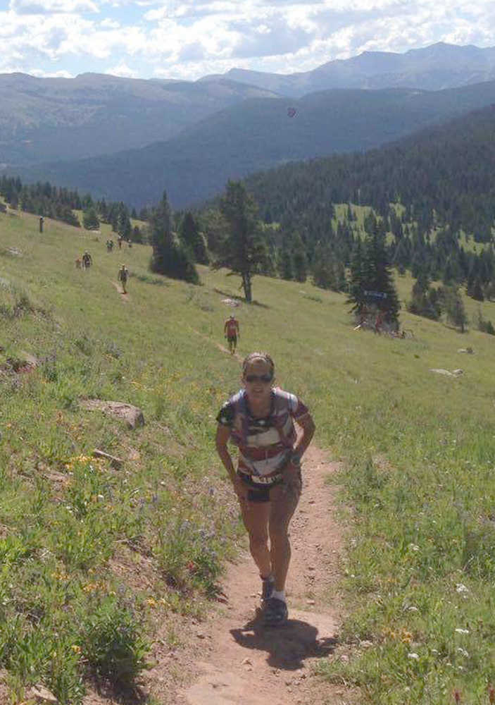 Photo provided by Connie Best Connie Best climbs the switchback on Vail mountain during the TransRockies Run before seven or so miles of downhill.