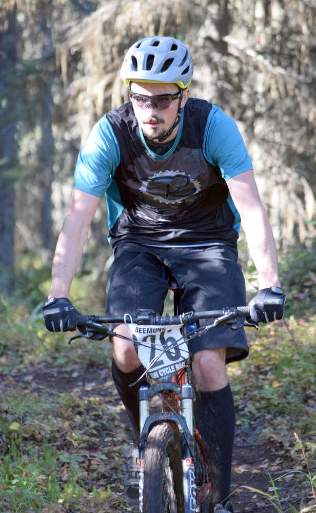 Photo by Jeff Helminiak/Peninsula Clarion Overall winner Nathan Kincaid finishes off a section of Mosquito singletrack Saturday at Tsalteshi Trails during Psychocross.