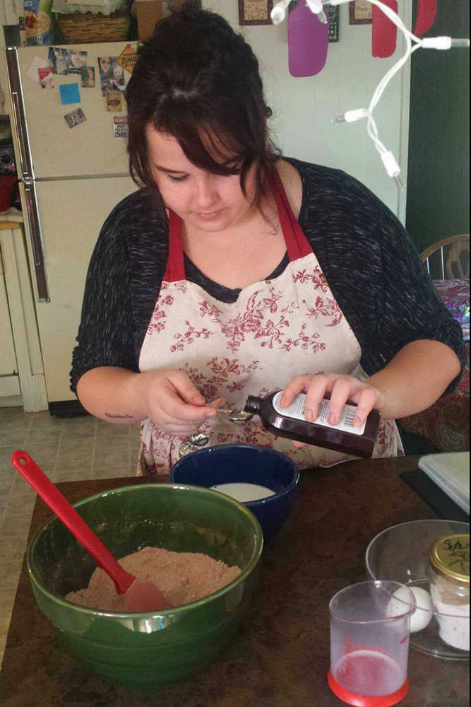 Photo courtesy Xandria Simms Xandria Simms works on a cake in her kitchen for her new business Boho Bakes.