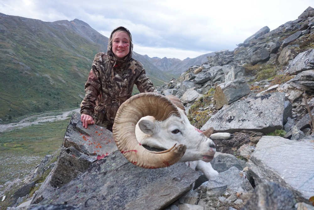 McKenzy Johnson poses with the Dall ram she shot on an Aug. 10 hunt with her father and a family friend. McKenzy was the only one to draw a sheep tag for the hunt, which occurred out past Tok.