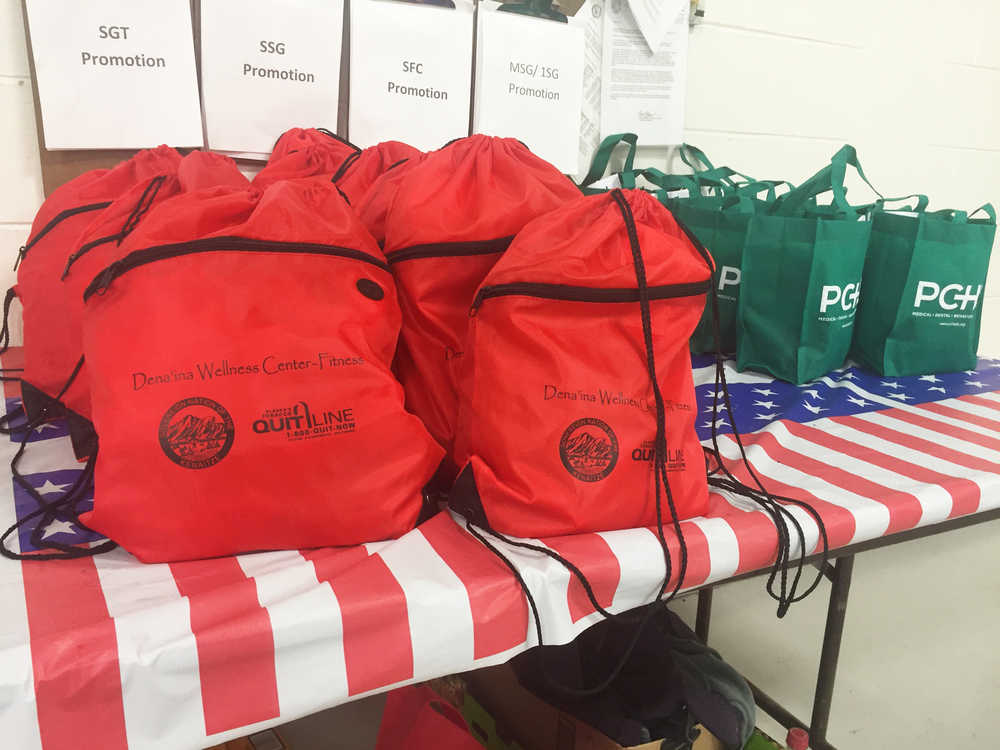 Photo by Megan Pacer/Peninsula Clarion Bags of basic necessities line the wall during a workshop to address area homelessness Thursday, Sept. 15, 2016 at the Alaska Army National Guard Armory in Kenai, Alaska. Agencies, church groups and community members gathered to brainstorm ways to help reduce homelessness on the Kenai Peninsula over the course of two nights.