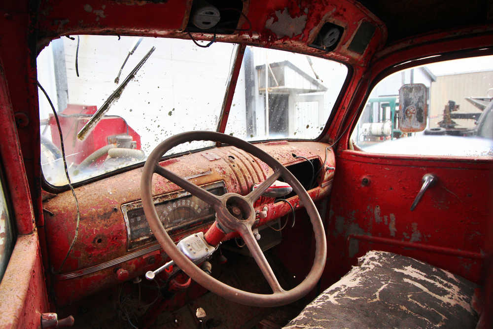 Ben Boettger/Peninsula Clarion The interior of the former Kenai Fire Department Number 3 fire truck is shown as the truck sits in the yard of Freddie Pollard's machine shop on Thursday, Sept. 8. Former Kenai Mayor John Williams is leading an effort to restore the 1941 Chevrolet truck to driveable condition.