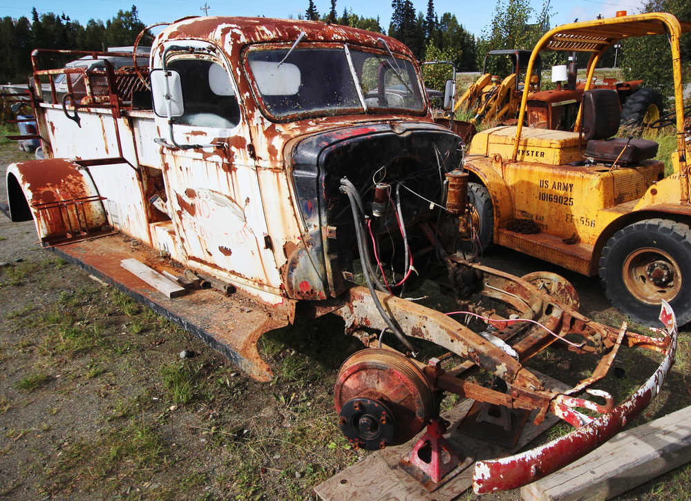 By Ben Boettger/Peninsula Clarion With its engine, pump, wheels, and front panels removed, the 1941 Chevrolet truck that once served as the Kenai Fire Department's Engine Number 3 sits in the yard of Freddie Pollard's machine shop on Thursday, Sept. 8, 2016 in Kenai, Alaska. Former Kenai Mayor John Williams is leading an effort to restore the truck to driveable condition.