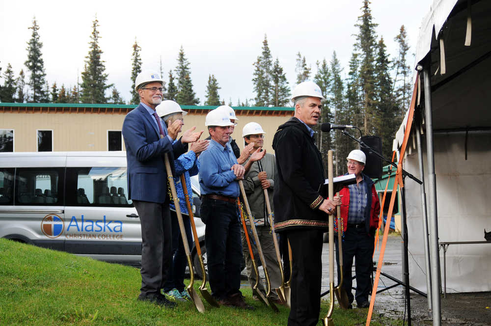 Photo by Elizabeth Earl/Peninsula Clarion Alaska Christian College President Dr. Keith Hamilton (front) speaks during a groundbreaking ceremony for the new Taikuu dormitory at the college's 15th anniversary celebration Friday, Sept. 16, 2016 near Soldotna, Alaska. The two-year Bible college serves Alaska Natives and this year has 10 students from the Navajo nation in Arizona.
