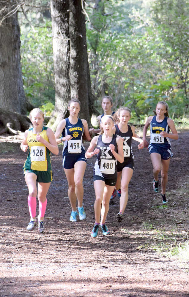 Photo by Jeff Helminiak/Peninsula Clarion Kenai Central's Jaycie Calvert (480) leads Seward's Ruby Lindquist, Homer's Megan PItzman, Homer's Audrey Rosencrans, Kenai Central's Riana Boonstra and Homer's Autumn Daigle at the Kenai Peninsula Borough meet earlier this month at Seward High School.