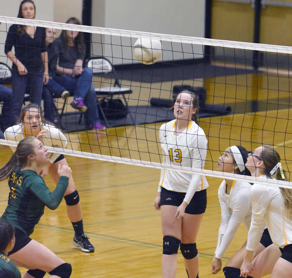 Photo by Jeff Helminiak/Peninsula Clarion Seward's Maggie Adkins and Nikiski's Emma Wik, Maddy Williams, Dessy Napoka and Melanie Sexton stare down the ball Friday at Nikiski High School.