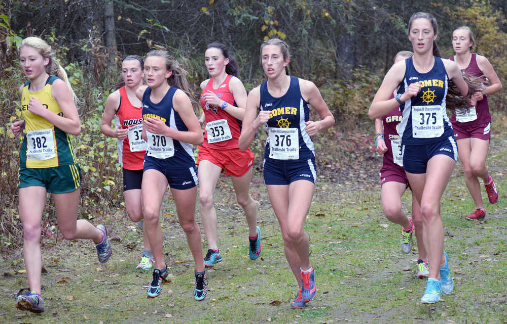 Photo by Jeff Helminiak/Peninsula Clarion Seward's Ruby Lindquist and Homer's Autumn Daigle, Audrey Rosencrans and Megan Pitzman pace the lead pack two kilometers into the Class 1-2-3A girls race at the Region III meet Saturday at Tsalteshi Trails. Pitzman, Rosencrans and Daigle went 1-2-3 to lead Homer to the girls crown.