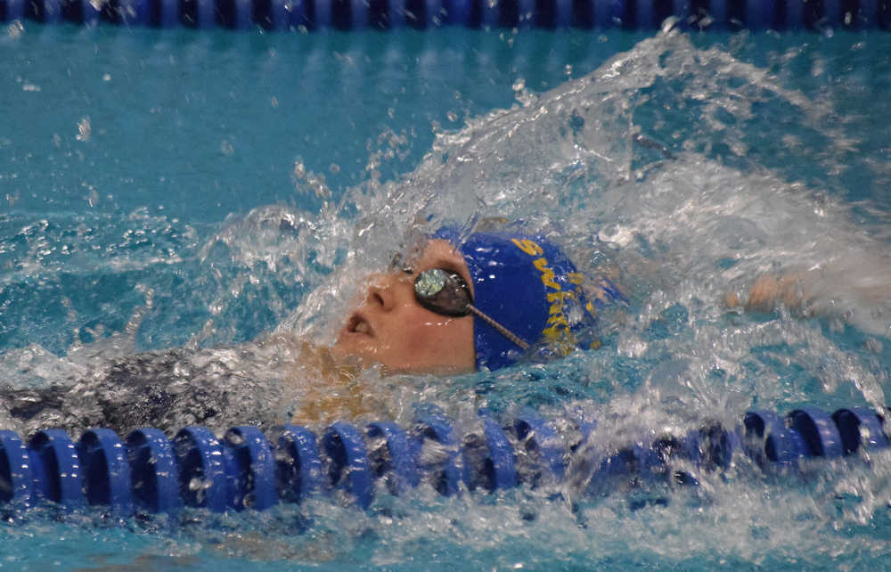 Photo by Joey Klecka/Peninsula Clarion Kodiak's Marina Cummiskey works her way to the victory in the girls 50-yard backstroke Friday at the SoHi Pentathlon in Soldotna. Cummiskey claimed the overall victory in the event.