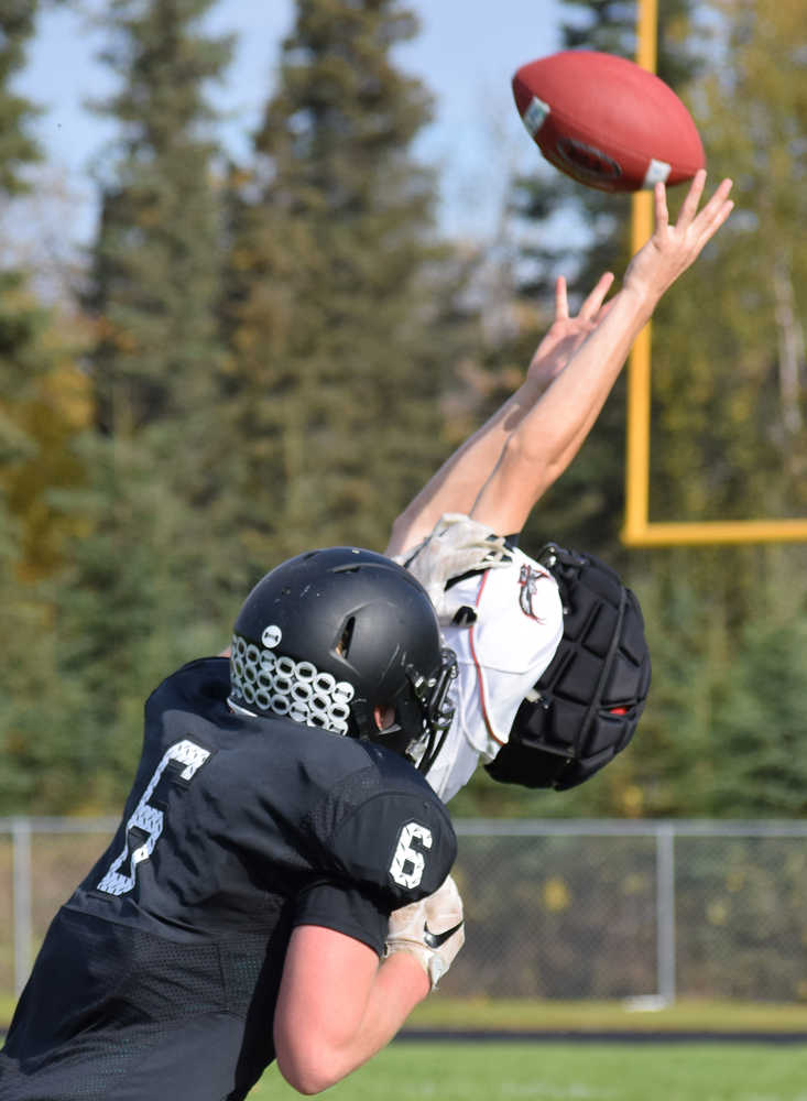 Photo by Joey Klecka/Peninsula Clarion Eielson defensive back Jerimiah Brown nearly intercepts a pass intended for Nikiski receiver Cody Handley Saturday afternoon at Nikiski High School.