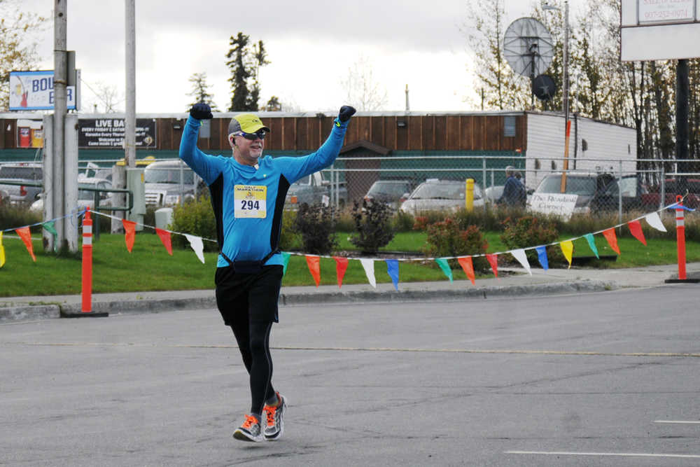 Photo by Elizabeth Earl/Peninsula Clarion Susan Craig of Soldotna keeps up the pace as she heads toward the finish line in the half-marathon event of the Kenai River Marathon on Sunday, Sept. 25, 2016 in Kenai, Alaska. Craig finished seventh in the half-marathon with a time of 1:42:10.