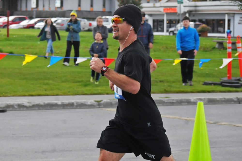 Photo by Elizabeth Earl/Peninsula Clarion Ken Felchle of Soldotna closes in on the finish line at the Kenai River Marathon on Sunday, Sept. 25, 2016 in Kenai, Alaska. Felchle finished third in the full marathon race with a time of 3:17:09.