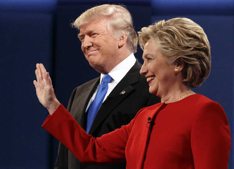 Republican presidential candidate Donald Trump, left, stands with Democratic presidential candidate Hillary Clinton at the first presidential debate at Hofstra University, Monday, Sept. 26, 2016, in Hempstead, N.Y. (AP Photo/ Evan Vucci)