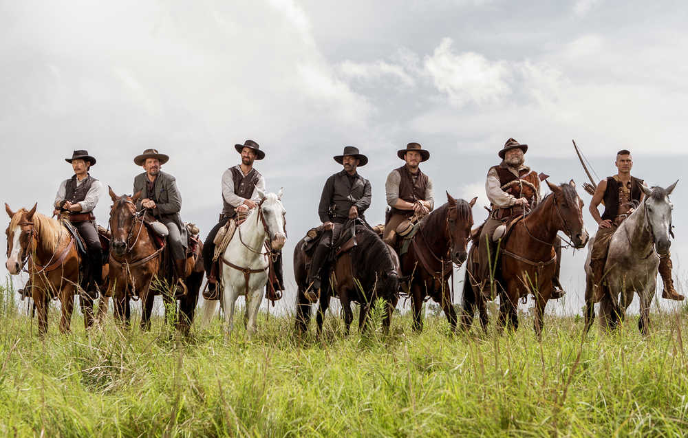 In this image released by Sony Pictures, Byung-hun Lee, from left, Ethan Hawke, Manuel Garcia-Rulfo, Denzel Washington, Chris Pratt, Vincent D'Onofrio and Martin Sensmeier appear in a scene from "The Magnificent Seven." (Sam Emerson/Sony Pictures via AP)
