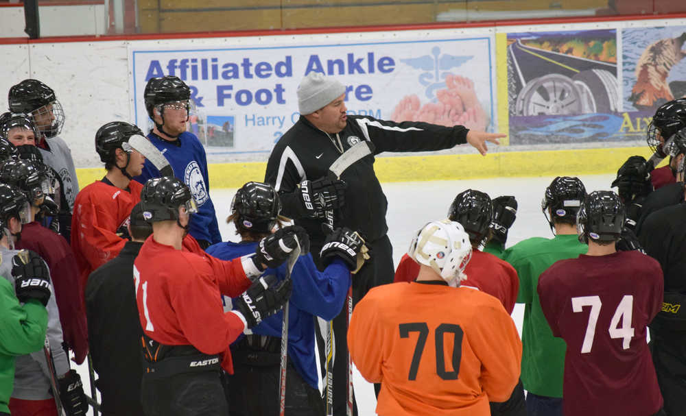Photo by Jeff Helminiak/Peninsula Clarion Kenai River Brown Bears head coach Jeff Worlton instructs the team at practice Wednesday at the Soldotna Regional Sports Complex ahead of the team's home opener tonight.