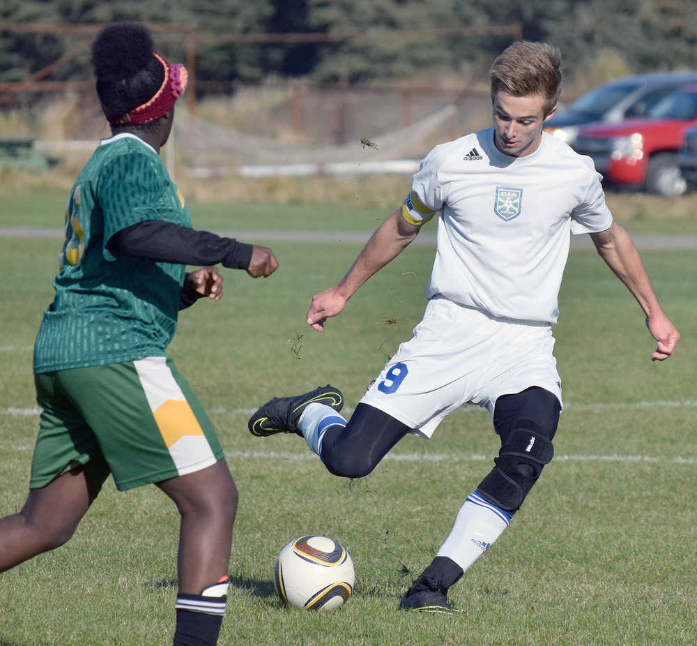 Photo by Joey Klecka/Peninsula Clarion Cook Inlet Academy striker Noah Leaf (9) winds up for the kick against Birchwood Christian Thursday morning at the Aurora Borealis Conference tournament at the Kenai Sports Complex fields.