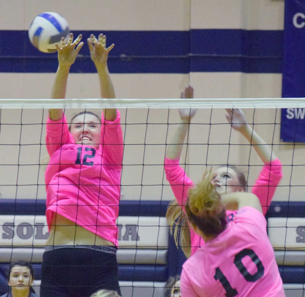 Photo by Joey Klecka/Peninsula Clarion Soldotna senior Drewe Zeek (12) blocks a shot from Kenai Central senior Abby Beck (10) Friday at Soldotna High School.