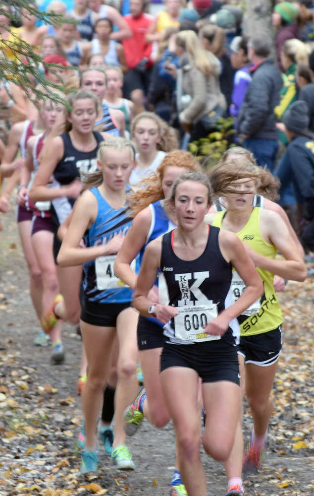 Photo by Joey Klecka/Peninsula Clarion Kenai Central junior Riana Boonstra (600) leads a pack of runners in the 4A girls race Saturay afternoon on the Bartlett High School trails.