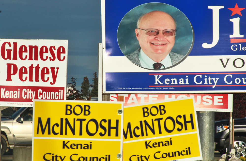 Ben Boettger/Peninsula Clarion Political signs for Kenai City Council candidates Glenese Pettey, Bob McIntosh, and Jim Glendening (running against candidates Jason Floyd and Christine Hutchison, who did not have signs present) line the intersection of the Kenai Spur Highway and Bridge Access Road on Monday, Oct. 3 in Kenai. Kenai's municipal election is today, and the two candidates with the most votes will serve three-year terms on the Kenai City Council.
