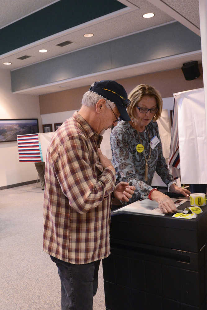 Photo by Megan Pacer/Peninsula Clarion Soldotna Planning and Zoning Commission member Tom Janz casts his vote during the municipal election Tuesday, Oct. 4, 2016 at Soldotna City Hall in Soldotna, Alaska. The city's proposed home-rule charter passed, and four unopposed city council candidates were elected.