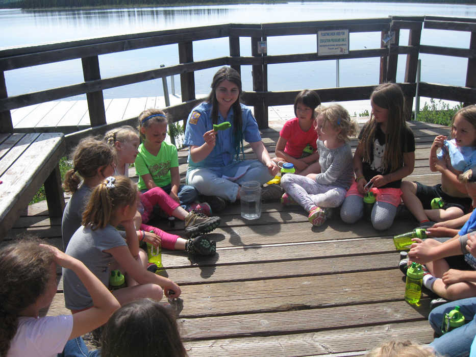 Ranger Macey teaches summer campers about the impacts of pollution to waterways on the Kenai National Wildlife Refuge. (Photo courtesy Kenai National Wildlife Refuge)