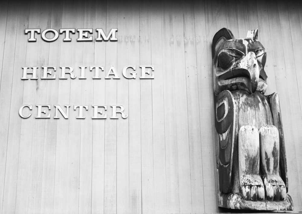 ADVANCE FOR WEEKEND Oct. 8-9, 2016 AND THEREAFTER - In this Sept. 27, 2016 photo, lettering and an eagle carving are displayed on the side of the Totem Heritage Center in Ketchikan, Alaska. For the past four decades, the center has worked to preserve Native totem poles and artifacts from around Southeast Alaska. The center, celebrating its 40th anniversary this year, was founded after a group of Native elders started talking in the 1960s and expressed concern about the state of totem poles in the region. (Taylor Balkom/Ketchikan Daily News via AP)