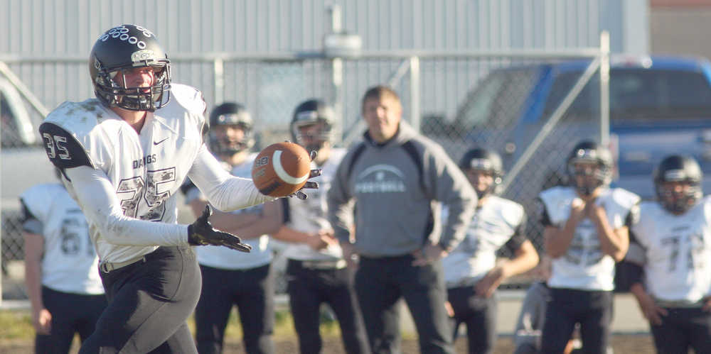 Photo by Eric Engman/News-Miner Nikiski's Patrick Perry tries to pull in a pass during third quarter action of the small schools state semifinal high school playoff football game between the Bulldogs and the Eielson Ravens Saturday afternoon, October 8, 2016 on Buck Nystrom Field at Ben Eielson High School. Eric Engman/News-Miner