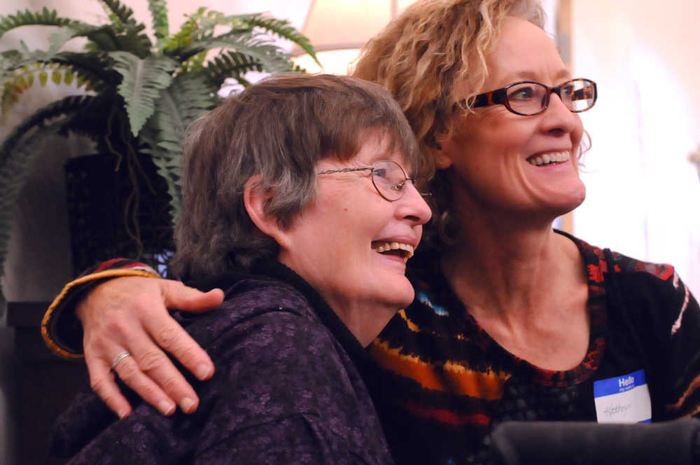 Photo by Elizabeth Earl/Peninsula Clarion Kathryn Dunagan (right) embraces longtime Amundsen Educational Center instructor Judi Walgenbach (left) at a retirement party for Walgenbach on Thursday, Oct. 6, 2016 in Soldotna, Alaska. Walgenbach, who founded the New Frontiers vocational learning center before it merged with the Amundson Educational Center, is retiring after 30 years of teaching. Former students, board members and friends swirled around her at the retirement party Thursday with gifts, handshakes and hugs.