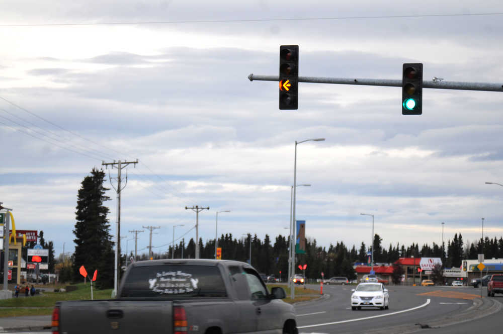 Photo by Elizabeth Earl/Peninsula Clarion A flashing yellow arrow indicates that drivers can turn left at the intersection of Walker Lane/Airport Way and the Kenai Spur Highway on Wednesday, Oct. 12, 2016 in Kenai, Alaska. The Alaska Department of Transportation and Public Facilities recently installed the new flashing yellow arrow signals, designed to help improve left-hand turn safety in intersections, in Kenai and Soldotna.