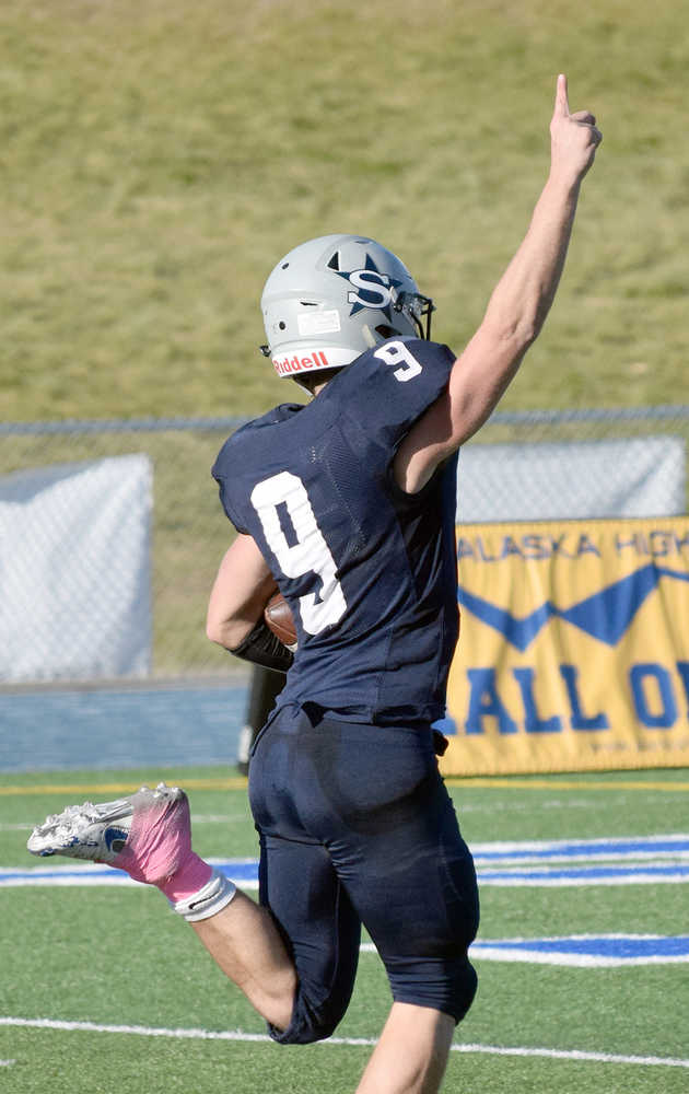 Photo by Joey Klecka/Peninsula Clarion Soldotna's Jace Urban points skyward as he scores on North Pole in Saturday's medium-schools semifinal game at Palmer High School.