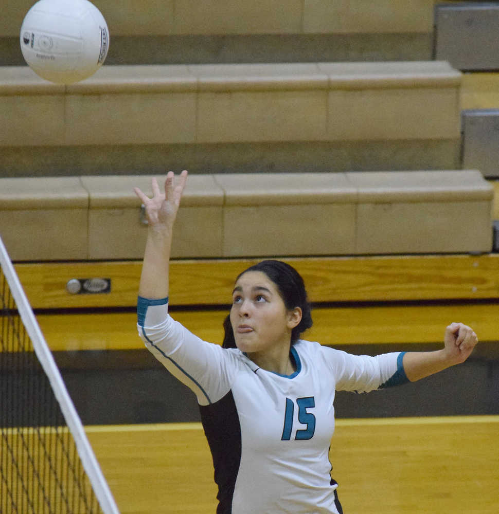 Photo by Joey Klecka/Peninsula Clarion Bulldogs senior Brianna Vollertsen gives the ball a tap Thursday evening against Houston at Nikiski High School.