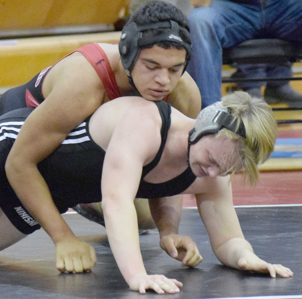 Photo by Jeff Helminiak/Peninsula Clarion Kenai Central's Keyshawn McEnerney controls Nikiski's Donovan Smith on Saturday at the Luke Spruill Memorial Tournament at Kenai Central. McEnerney notched a technical fall over Smith at 160 pounds.