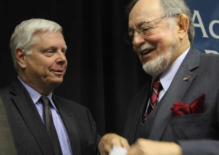 Steve Lindbeck, left, the Democratic challenger for Alaska's sole seat in the U.S. House, talks with the Republican incumbent, Don Young, after a forum Monday, Oct. 17, 2016, in Anchorage, Alaska.  Libertarian Jim McDermott also took part in the forum. (AP Photo/Mark Thiessen)