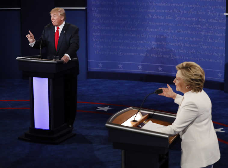 Democratic presidential nominee Hillary Clinton and Republican presidential nominee Donald Trump debate during the third presidential debate at UNLV in Las Vegas, Wednesday, Oct. 19, 2016. (Mark Ralston/Pool via AP)