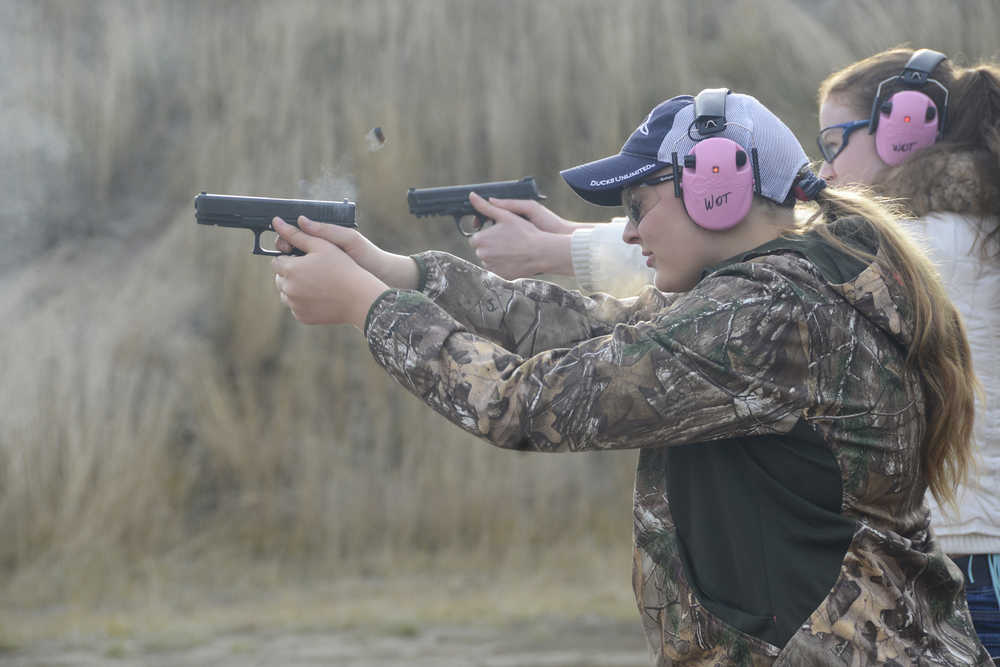 Photo by Megan Pacer/Peninsula Clarion Erin Hoogenboom, 14, shoots a hand gun at a target during a meeting of this year's Teens on Target program Thursday, Oct. 20, 2016 at the Snowshoe Gun Club Range in Kenai, Alaska.