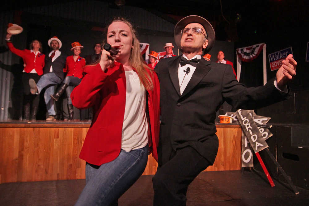 Photo by Ben Boettger/Peninsula Clarion Hannah Tauriainen and Joe Rizzo open up the Triumvirate Theatre's "Lame Ducks and Dark Horses" political satire play with a song backed by a chorus line during a dress rehearsal Monday, Oct. 24, 2016 near Kenai, Alaska.
