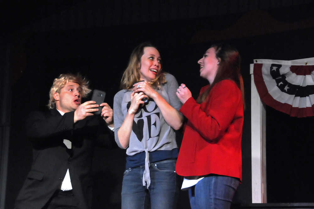 Photo by Elizabeth Earl/Peninsula Clarion Donald Trump (Tyler Payment, left) and Hillary Clinton (Hannah Tauriainen, right) harass a Millennial voter (Delana Duncan Green) for her support during a dress rehearsal for Triumvirate Theatre's "Lame Ducks and Dark Horses" political satire play Monday, Oct. 24, 2016 near Kenai, Alaska.
