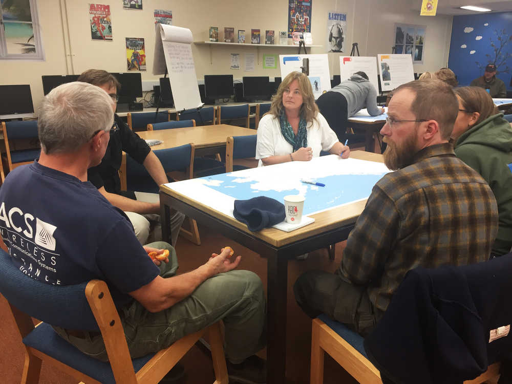 Photo by Megan Pacer/Peninsula Clarion Kenai Peninsula residents chat with Marcheta Moulton, the small federal programs manager for the Alaska Department of Transportation and Public Facilities, during an open house Wednesday, Oct. 2, 2016 at Soldotna High School. DOT is hosting public meetings around the state to gather input for a new Alaska Statewide Bicycle and Pedestrian Master Plan.